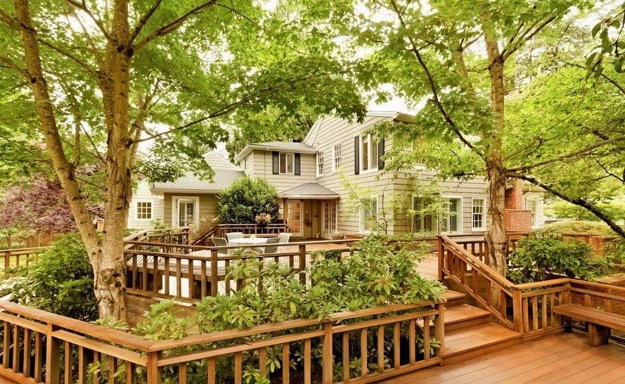 Classic wood deck with warm stain overlooking a backyard